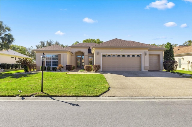 mediterranean / spanish-style home with a front lawn and a garage