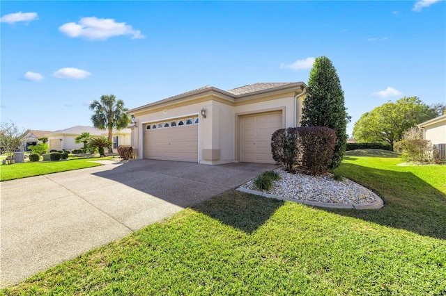 view of front of home featuring a front lawn and a garage