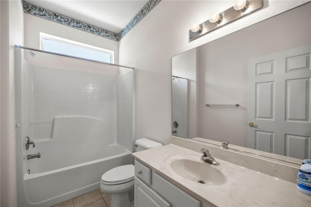 full bathroom featuring tub / shower combination, toilet, vanity, and tile patterned flooring