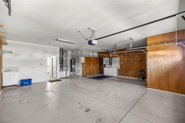 garage with water heater and a garage door opener