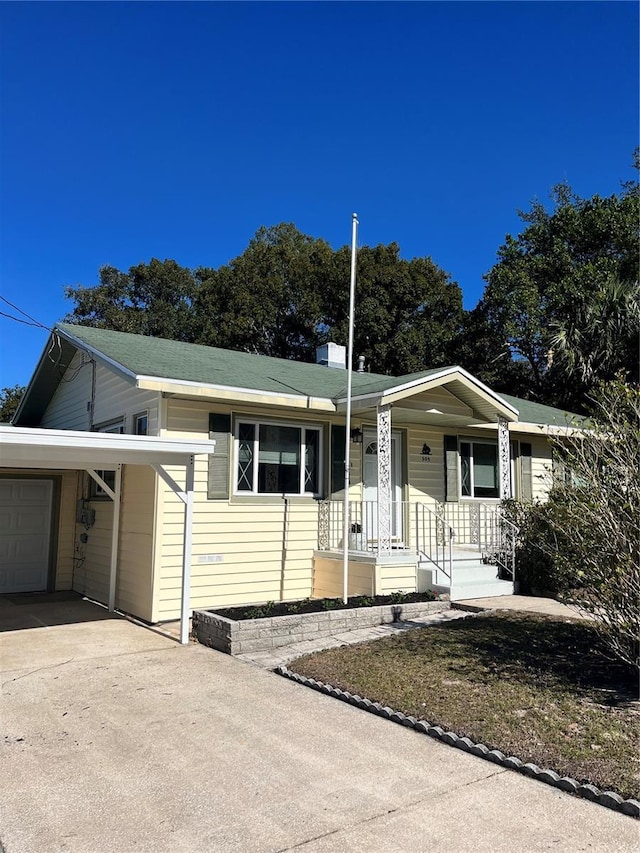 view of front facade with a carport