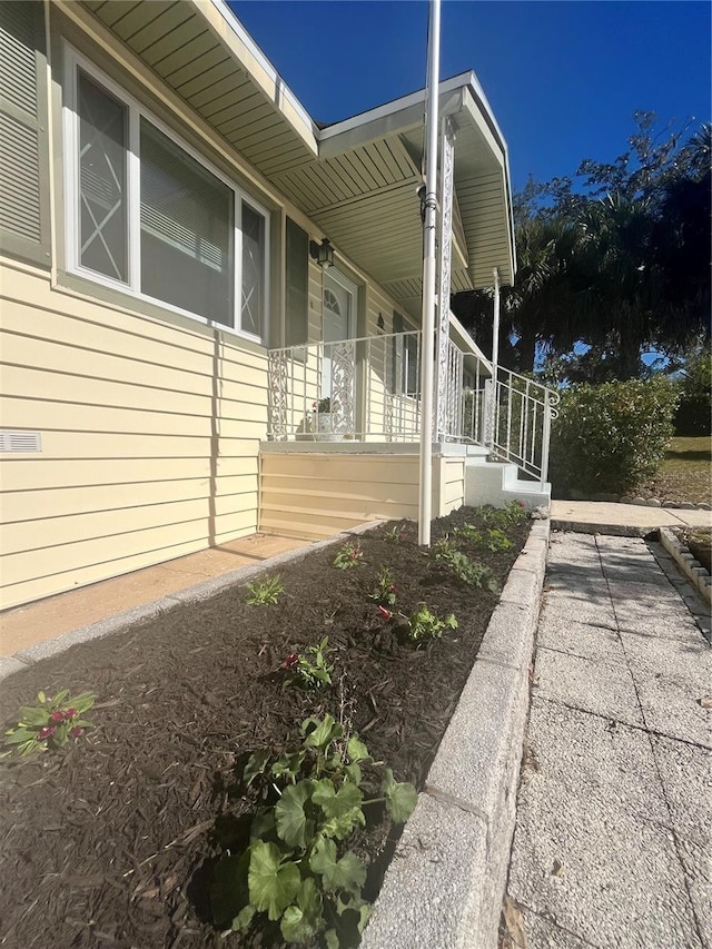 view of side of property with a porch