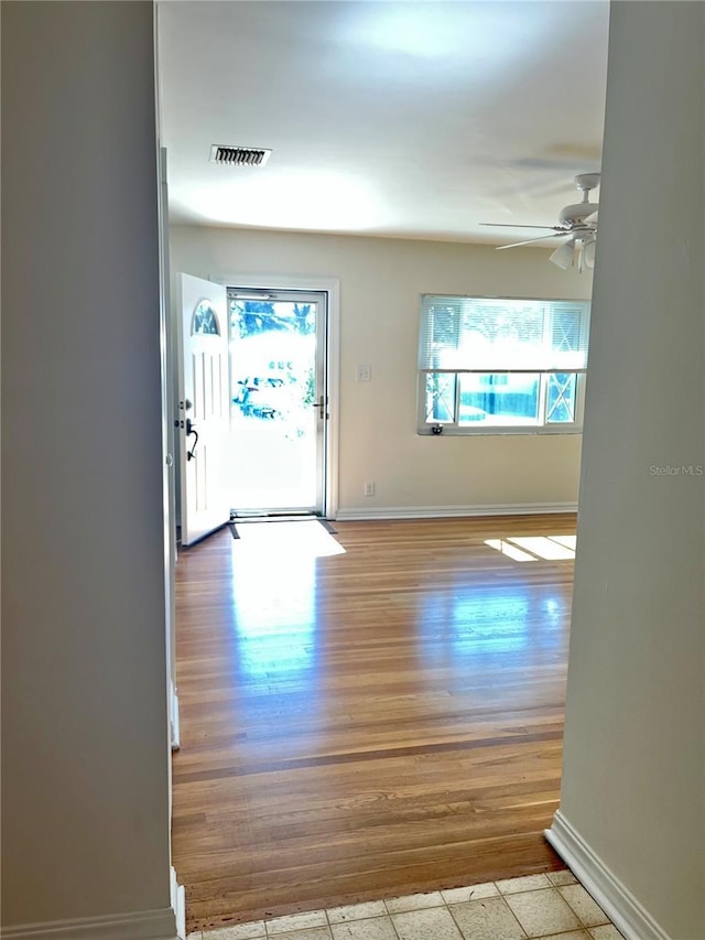 interior space featuring ceiling fan