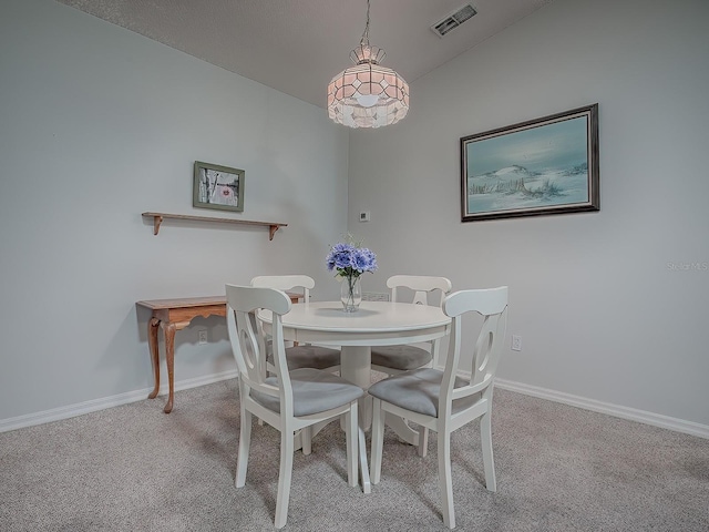 dining room featuring light colored carpet