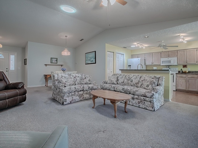 carpeted living room with a textured ceiling, ceiling fan, and lofted ceiling