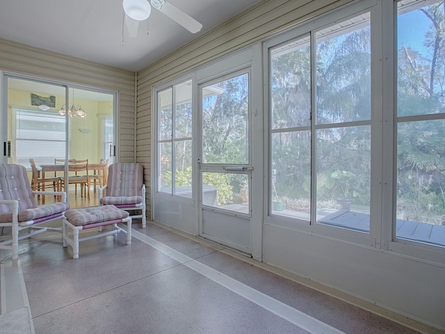 sunroom / solarium featuring ceiling fan and a healthy amount of sunlight