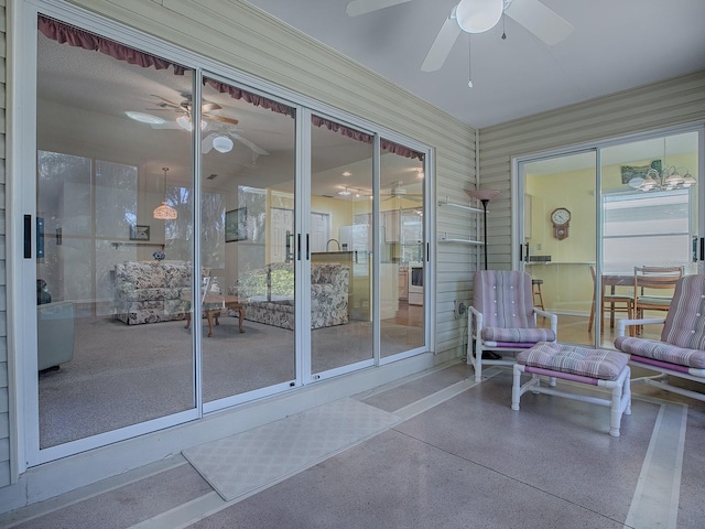 entrance to property featuring ceiling fan
