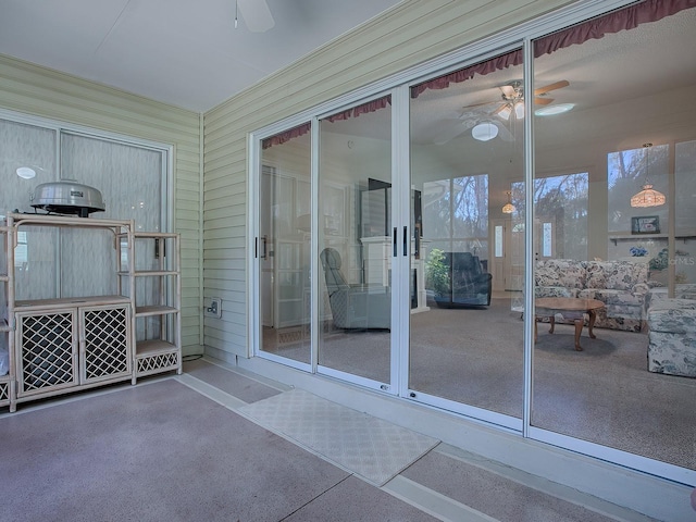 exterior space with ceiling fan