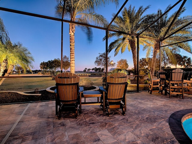 view of patio terrace at dusk