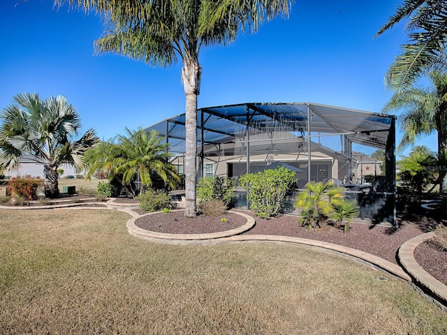 view of yard with glass enclosure