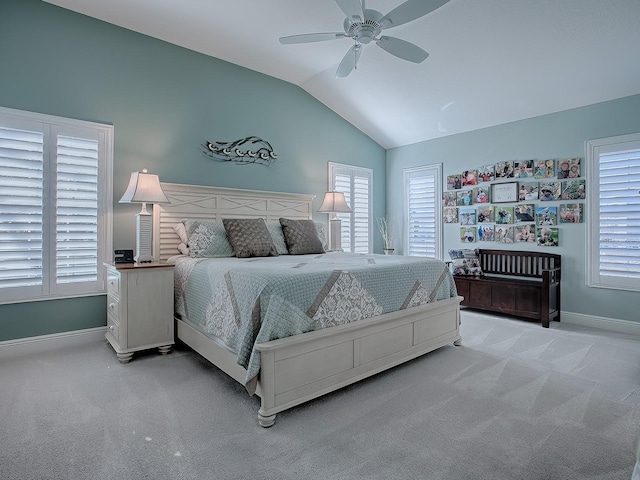 bedroom featuring ceiling fan, light carpet, and vaulted ceiling