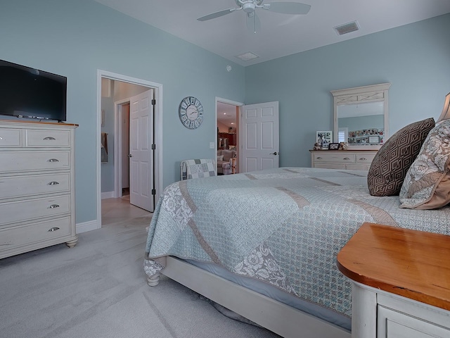 bedroom featuring light carpet and ceiling fan