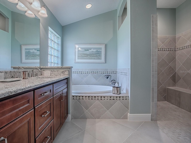 bathroom with tile patterned floors, vanity, lofted ceiling, and plus walk in shower