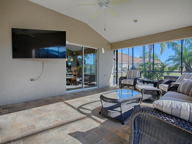 exterior space featuring ceiling fan and lofted ceiling