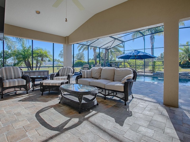 sunroom with vaulted ceiling, a pool, and a wealth of natural light