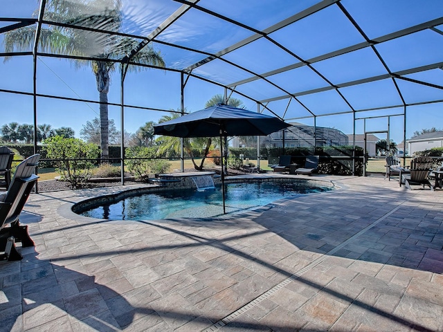 view of swimming pool featuring a lanai and a patio