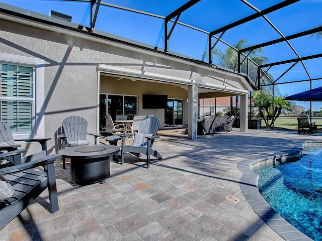 exterior space featuring ceiling fan and a lanai