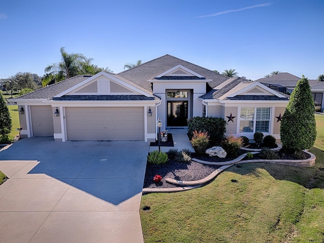 ranch-style home featuring a front yard and a garage