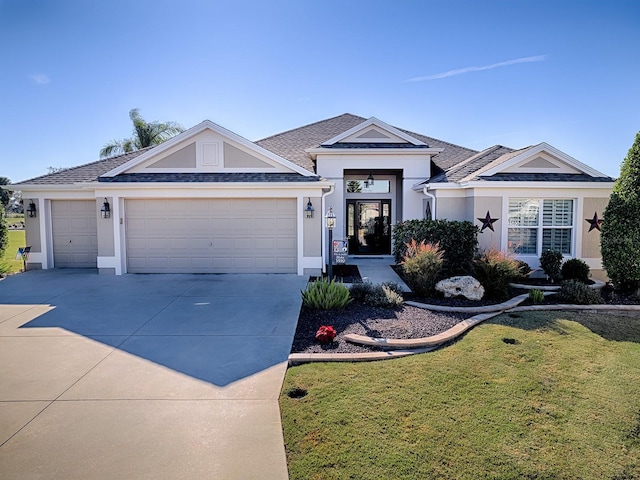 ranch-style home with a front yard and a garage