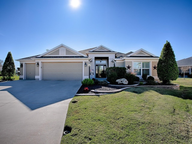 view of front facade with a garage and a front lawn