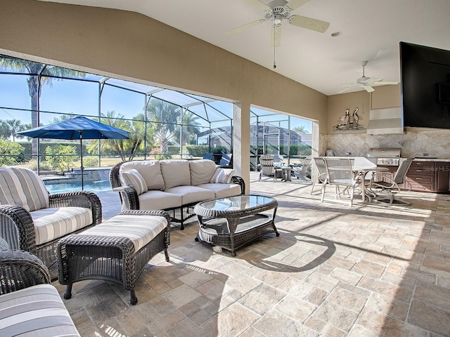 view of patio with outdoor lounge area, ceiling fan, and a lanai