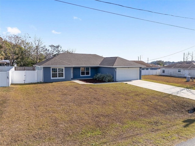 ranch-style house featuring a garage and a front lawn