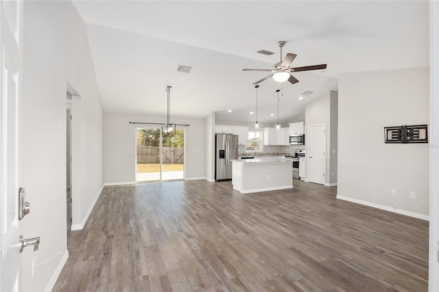 unfurnished living room featuring hardwood / wood-style flooring, ceiling fan, and high vaulted ceiling