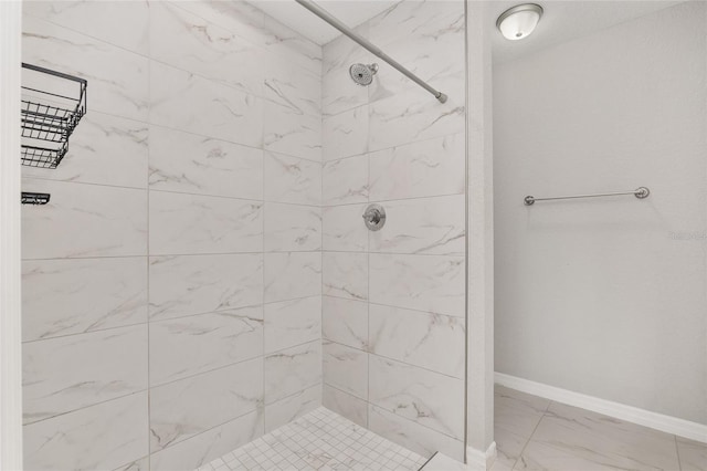 bathroom featuring tiled shower