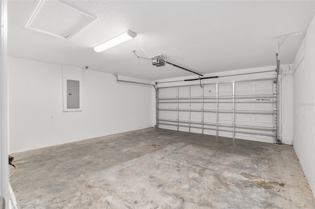 garage featuring electric panel and a garage door opener