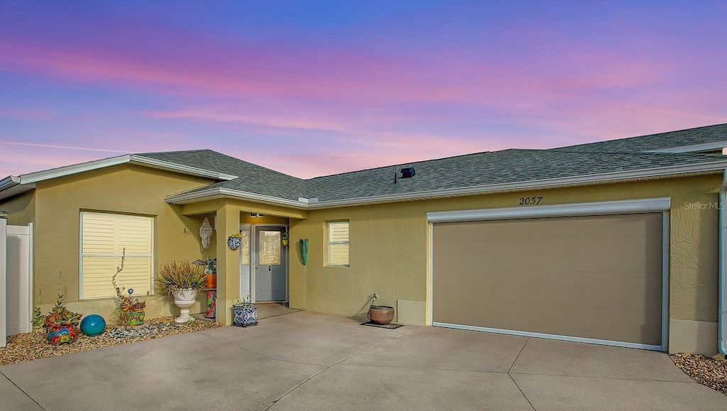 ranch-style home featuring a garage