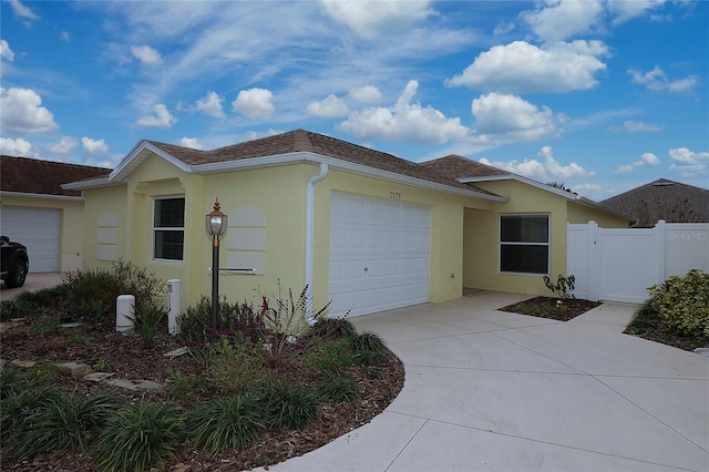 view of side of property with a garage