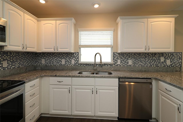 kitchen with white cabinets, sink, and appliances with stainless steel finishes