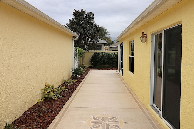 view of property exterior featuring a patio area