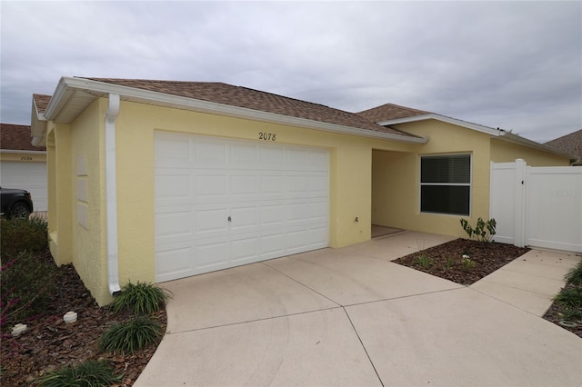 ranch-style house featuring a garage