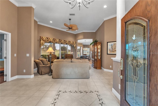 tiled living room with ceiling fan with notable chandelier and ornamental molding