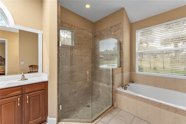 bathroom featuring tile patterned floors, vanity, and independent shower and bath