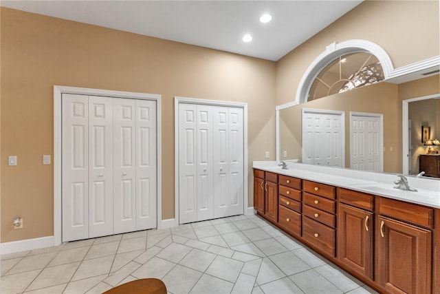 bathroom featuring tile patterned flooring and vanity