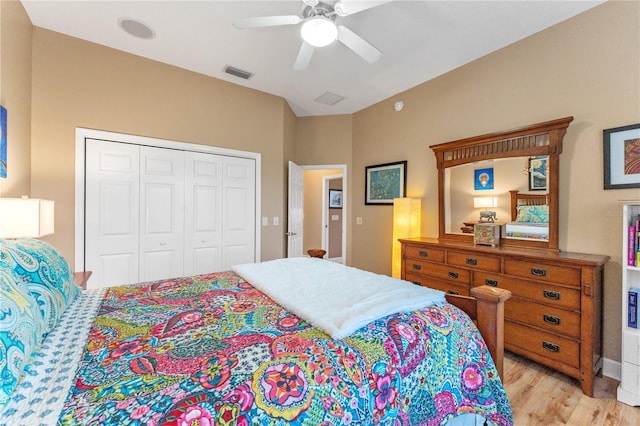 bedroom with ceiling fan, a closet, and light wood-type flooring