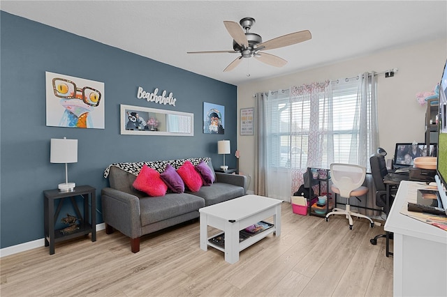 living room with ceiling fan and light hardwood / wood-style flooring