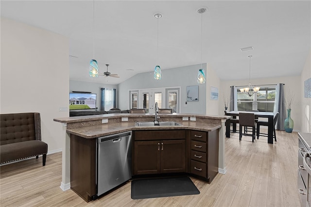 kitchen with pendant lighting, ceiling fan with notable chandelier, sink, stainless steel dishwasher, and dark brown cabinetry