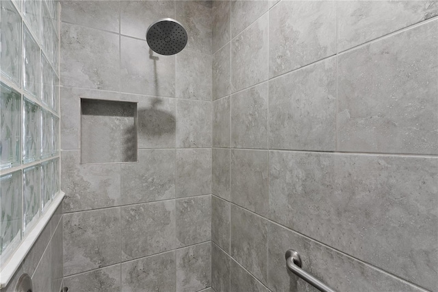 details with a tile shower