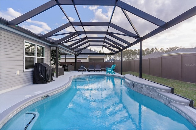 view of pool with an outdoor hangout area, a patio area, grilling area, and a lanai