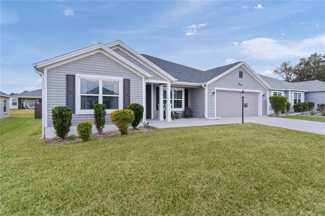 ranch-style home featuring a garage and a front lawn