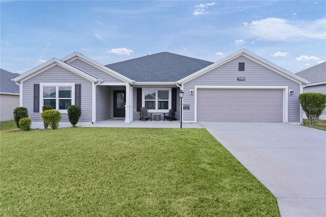 single story home with a front yard and a garage