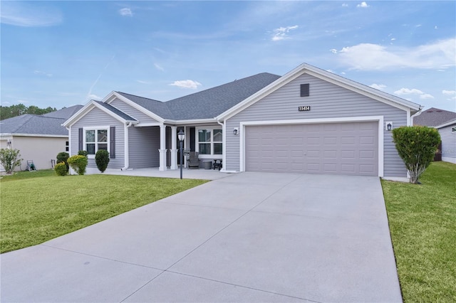 ranch-style home featuring a front yard and a garage