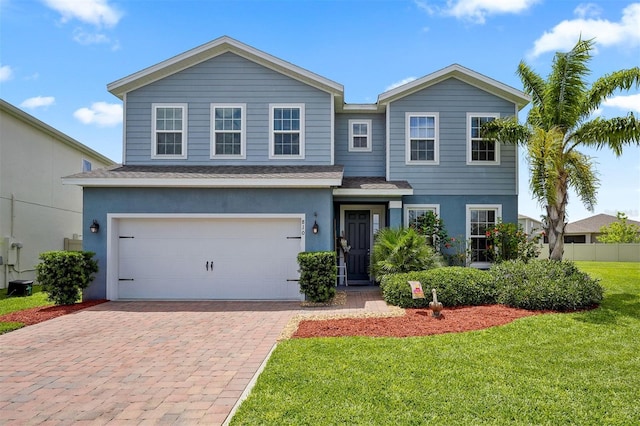 view of front of house with a front lawn and a garage