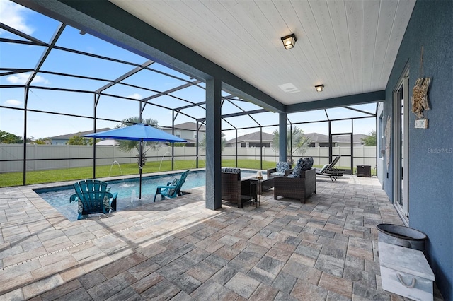 view of patio featuring a lanai and a fenced in pool