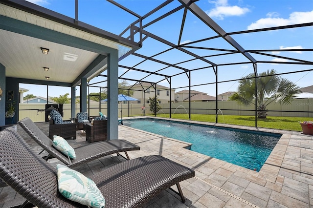 view of pool featuring a patio area, pool water feature, and glass enclosure