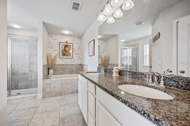 bathroom with separate shower and tub, vanity, and tile patterned floors