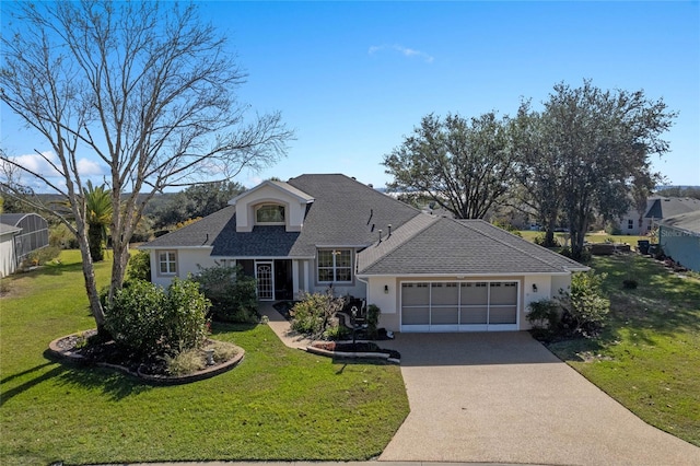 view of front of house featuring a garage and a front lawn